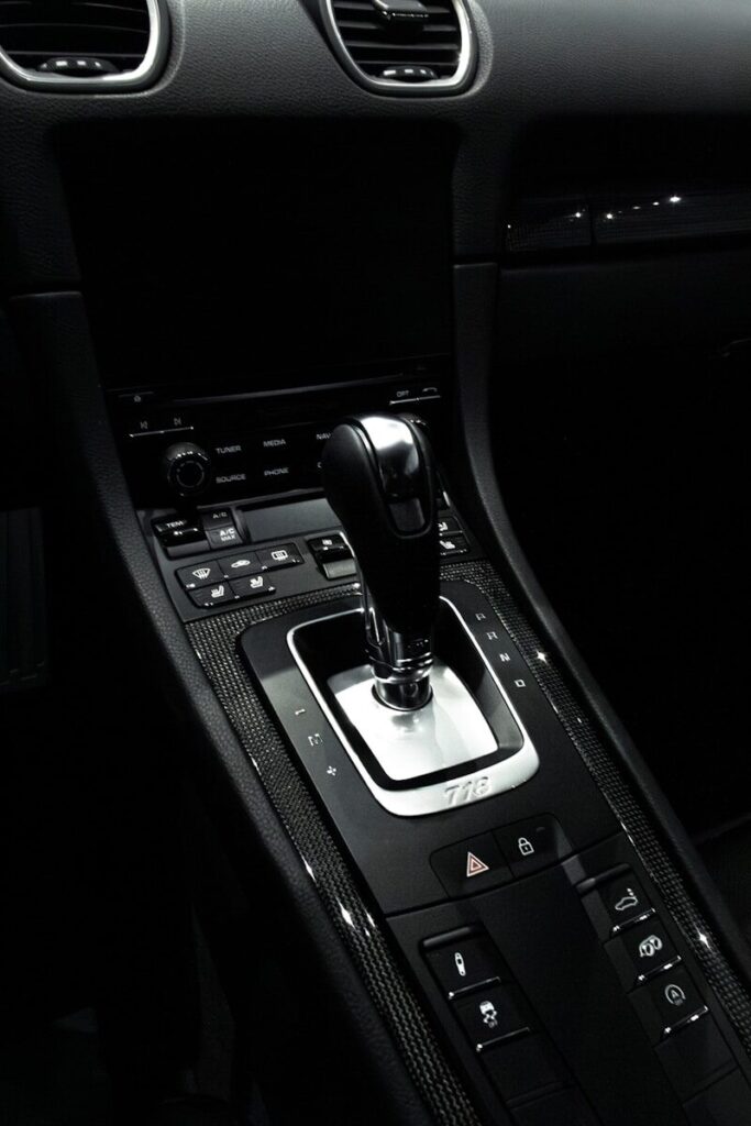 the interior of a car with a gear shift